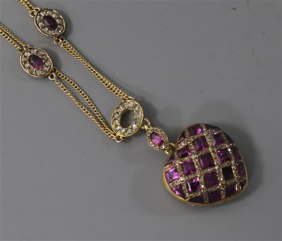 An early 20th century yellow metal, amethyst, rose cut diamond and rock crystal set heart shaped pendant locket on chain.